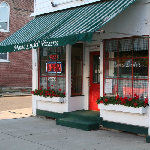 Front of a small business storefront representing the importance of having a website